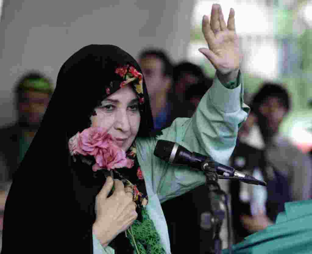FILE - In this Tuesday, June 9, 2009 file photo, Zahra Rahnavard, the wife of reformist candidate Mir Hossein Mousavi, waves to the people during a rally at Heidarnia stadium, during the final days of the election race in Tehran, Iran. In a part of the Mu