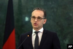 German Foreign Minister Heiko Maas, speaks during a press conference with Afghanistan's Foreign Minister Salahuddin Rabbani, in Kabul, Afghanistan, March 11, 2019.