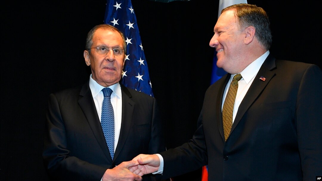 U.S. Secretary of State Mike Pompeo, right, shakes hands with Russia's Foreign Minister Sergei Lavrov as they meet on the sidelines of the Arctic Council Ministerial Meeting in Rovaniemi, Finland, May 6, 2019.