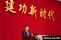 រូបឯកសារ៖ ប្រធានាធិបតី​ចិន លោក Xi Jinping ថ្លែង​សុន្ទរកថា​នៅ​ក្នុង​ការជួបជុំ​គ្នា​មួយ​ដែល​រៀបចំ​ឡើង​ដោយ​មជ្ឈិមបក្សនៅ​ក្នុង​ទីក្រុង​ប៉េកាំង ប្រទេស​ចិន ថ្ងៃទី ៣១ ខែធ្នូ ឆ្នាំ២០២១។ (Yan Yan/Xinhua via AP)