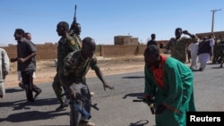 Sudan's army soldiers celebrate the army's liberation of an oil refinery in North Bahri, Sudan, Jan. 25, 2025.