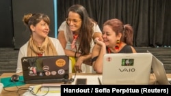 María Cristina Arboleda Puente (L) and Isabel Cristina González Ramírez (R) from Ecuador’s Sentimos Diverso attend Chicas Poderosa’s New Ventures Lab, hosted by Google in Sao Paulo, Feb. 1, 2018. 