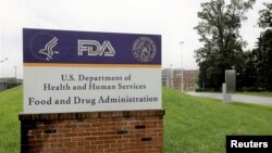 FILE - Signage is seen outside of the Food and Drug Administration (FDA) headquarters in White Oak, Maryland, Aug. 29, 2020. 