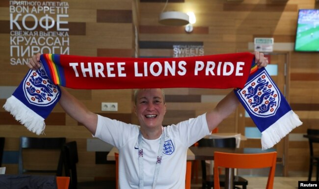 FILE - LGBT rights campaigner Di Cunningham displays a scarf during an interview with Reuters in Volgograd, Russia, June 18, 2018.