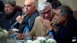 Asfandyar Wali Khan, second right, head of the Awami National Party, presides over a major conference with various political parties and religious group representatives in Islamabad, Feb. 14, 2013.