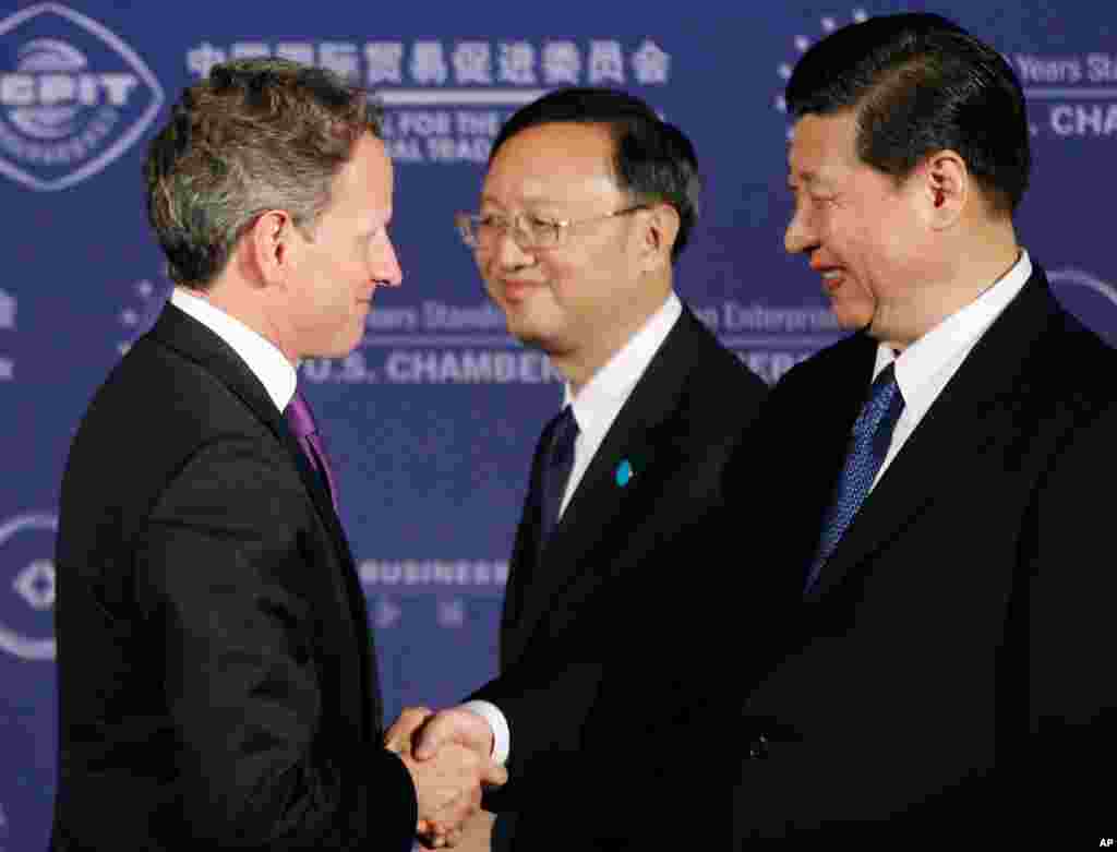 Treasury Secretary Tim Geithner greets Xi with Chinese Foreign Minister Yang Jiechi at the U.S. Chamber of Commerce in Washington, Tuesday, Feb. 14, 2012. (AP)