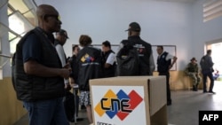 Members of the international delegation of electoral observers visit one of the main voting centers to verify the installation of polling stations to be used in Sunday's presidential election, in Caracas, Venezuela, on July 26, 2024.