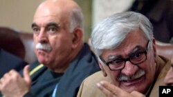 A medical worker takes a swab sample from a resident to be tested for the COVID-19 in Wuhan in China's central Hubei province.&nbsp;Nervous residents of the pandemic epicenter queued up across the city for testing after a new cluster of cases sparked a mass screening campaign.