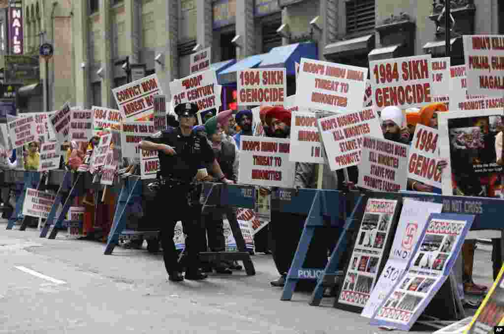 Protestors stage a demonstration against Indian Prime Minister Narendra Modi across the street from Madison Square Garden, where Modi spoke to a capacity crowd from the Indian-American community, Sunday, Sept. 28, 2014, in New York. A day after addressing
