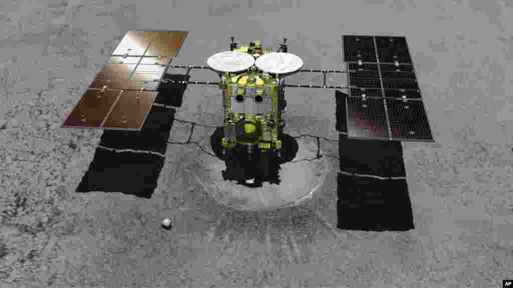 FILE - This computer graphic image provided by the Japan Aerospace Exploration Agency (JAXA) shows the Japanese unmanned spacecraft Hayabusa2 approaching on the asteroid Ryugu.