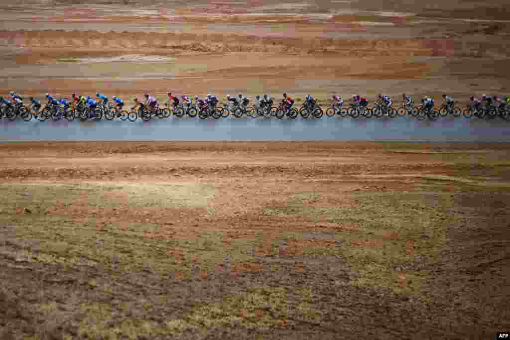 The pack rides during the second stage of the Saudi Tour, from Sadus Castle to Al Bujairi near the capital Riyadh, Saudi Arabia.