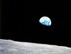 FILE - This image, called "Earthrise," is the first photograph of a distant blue Earth above the moon, taken by the Apollo 8 crew on Dec. 24, 1968.