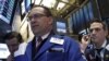 Traders work on the floor of the New York Stock Exchange, March 28, 2016.