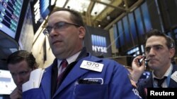 Traders work on the floor of the New York Stock Exchange, March 28, 2016.