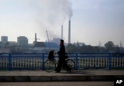 FILE - Smoke billows from the chimneys of Pyongyang Power Plant, which supplies much of the power and hot water needs for central Pyongyang, in Pyongyang, North Korea, Oct. 21, 2018. U.S. President Donald Trump said he walked away from his second summit with North Korean leader Kim Jong Un because Kim demanded the U.S. lift all of its sanctions, a claim that North Korea's delegation denies.