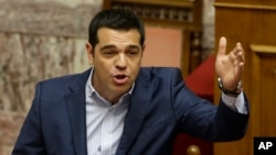Greek Prime Minister Alexis Tsipras answers opposition questions in parliament in Athens, July 31, 2015. 