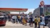 Motorists line up at a gas station in Maputo, Dec. 27, 2024. Fear has taken hold in Mozambique's capital, which has been subjected to barricades, looting and vandalism following the disputed confirmation of the ruling party's victory in October elections.