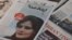 Newspapers with Amini, a victim of country's "morality police", are seen in Tehran