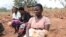 A teenage mother sits with other women, in Phalombe district, Malawi. (Lameck Masina/VOA)