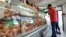 A man looks at meat on display inside a butcher shop in Buenos Aires, Argentina, Oct. 29, 2018. 