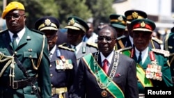 President Mugabe said apart from their security duties the armed forces were also transforming people’s lives through community services such as constructing schools and providing food aid. (Photo: VOA)