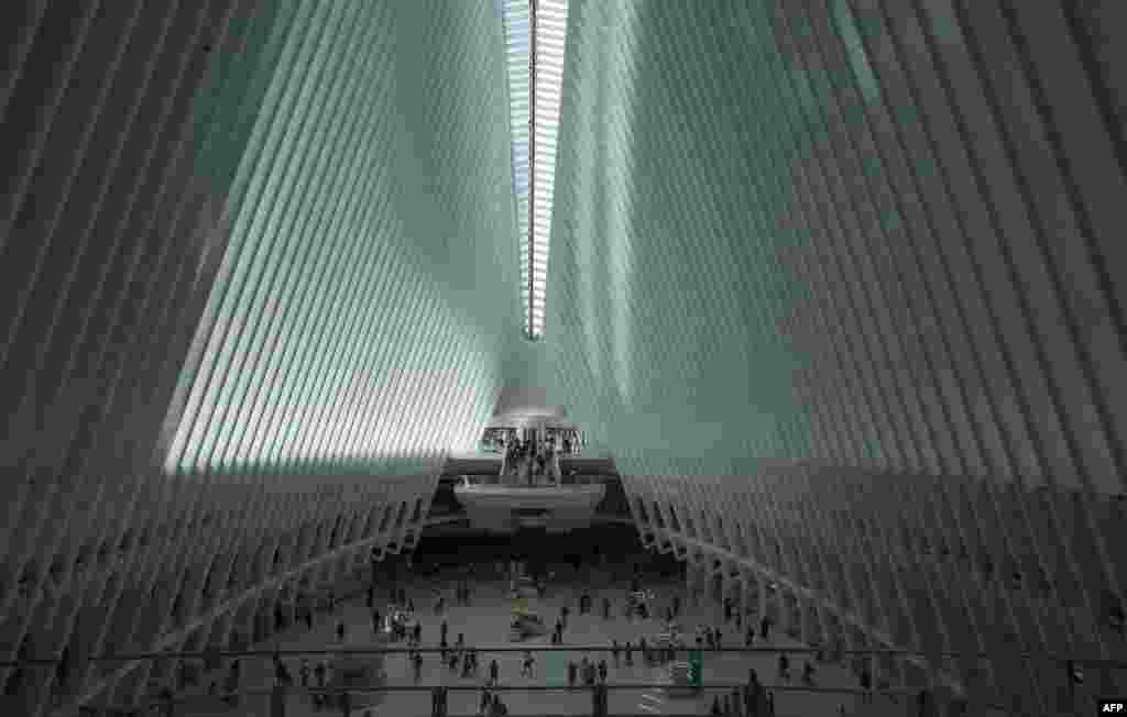 (FILE)Commuters travel through the Oculus transportation hub in New York, on July 30 2021. The roof of the building opens every September 11 as a memorial to the victims of the 9/11 attacks.