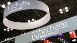 FILE - In this May 28, 2015 file photo, signage for Hachette Book Group are displayed at BookExpo America in New York. 