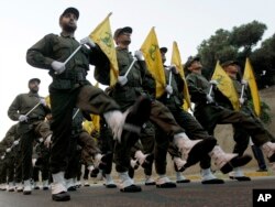 FILE - Hezbollah fighters parade in a southern suburb of Beirut, Lebanon, Nov. 12, 2010.