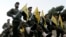 FILE - Hezbollah fighters parade in a southern suburb of Beirut, Lebanon, Nov. 12, 2010.
