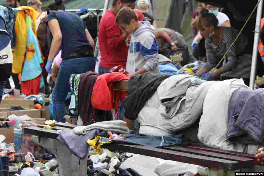 Just a few meters from the border, aid workers supply refugees with food, clothing and indoor places to sleep. Refugees said they were surprised by Croatia’s generosity after being told by smugglers they would not be welcome, in Harmica, Croatia, Sept. 20