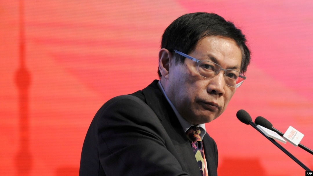 FILE - Ren Zhiqiang, the former chairman of state-owned property developer Huayuan Group, speaks at the China Public Welfare Forum in Beijing, Nov. 18, 2013. Ren who criticized the government's handling of the COVID-19 pandemic was jailed for 18 years on Sept. 22, 2020. 