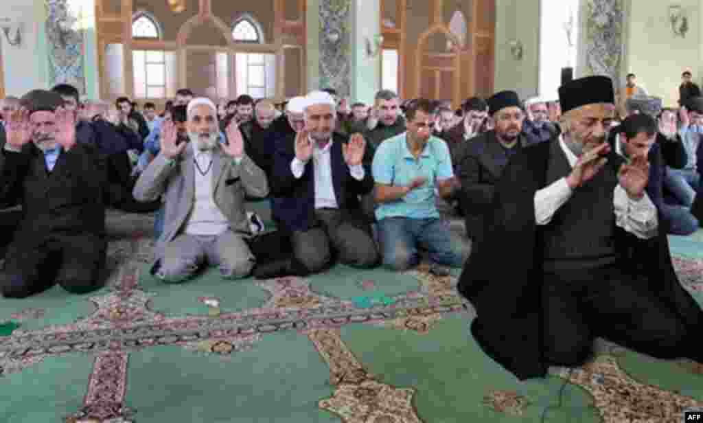 Worshippers perform the Eid al-Adha prayers in the mosque of Shuvalan pilgrimage site near Baku, Azerbaijan, on Tuesday, Nov. 16, 2010. Muslims throughout the world celebrate the holiday of Eid al-Adha, Feast of Sacrifice, when Muslims around the world sl