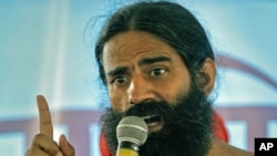 India's yoga guru Swami Ramdev addresses supporters during his fast against corruption in the northern Indian town of Haridwar, June 8, 2011