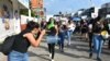 Journalists cover an International Women's Day protest in Tapachula, Mexico. A joint partnership is offering training and support to women in media and politics in Mexico, Kenya and Sri Lanka. (Courtesy - IWMF)