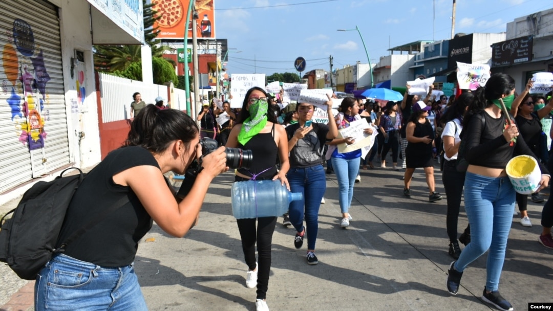 Journalists cover an International Women's Day protest in Tapachula, Mexico. A joint partnership is offering training and support to women in media and politics in Mexico, Kenya and Sri Lanka. (Courtesy - IWMF)