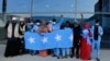 Survivors of a boat tragedy that killed more than two dozen Somali migrants off the coast of Madagascar arrive at Aden Adde International Airport in Mogadishu, Somalia, on Dec. 7, 2024.