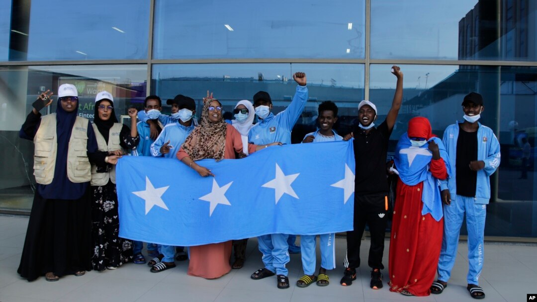 Survivors of a boat tragedy that killed more than two dozen Somali migrants off the coast of Madagascar arrive at Aden Adde International Airport in Mogadishu, Somalia, on Dec. 7, 2024.