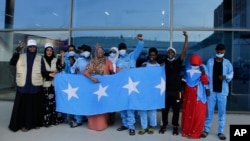 Survivors of a boat tragedy that killed more than two dozen Somali migrants off the coast of Madagascar arrive at Aden Adde International Airport in Mogadishu, Somalia, on Dec. 7, 2024.