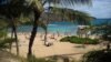 FILE - People enjoy a beach day at Hanauma Bay, on the east side of Oahu, Hawaii.