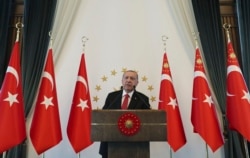 Turkey's President Recep Tayyip Erdogan speaks to a group of US businessmen at his palace, in Ankara, Turkey, Sept. 10, 2019.