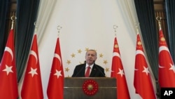 FILE - Turkey's Recep Tayyip Erdogan speaks at the Presidential palace in Ankara, Turkey, Sept. 10, 2019. 