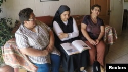 Former nuns Marcela Quitral, Yolanda Tondreaux and Eliana Macias, from the Sisters of the Good Samaritan order, attend an interview with Reuters in Talca, Chile, Feb. 15, 2019. 