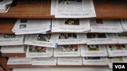 Old issues of the Cambodia Daily newspaper on display at the Daily's office, Phnom Penh, Cambodia, September 4, 2017. (Khan Sokummono/VOA Khmer) 