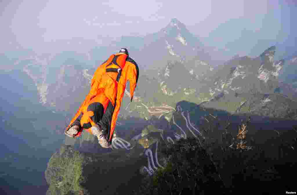 Hungarian wingsuit flyer Victor Kovats jumps off a mountain at Tianmen Mountain National Park in Zhangjiajie, Hunan province, China, Oct. 8, 2013. Kovats died after failing to deploy his parachute prior to landing at the world championship staged in central China. His body was found after a team of more than 200 rescuers carried out searching by foot in the forests with no helicopter available on the spot. Initial analysis said the reason for the wingsuit flyer's plunge might relate to "technical problem during the trial".