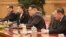 North Korean leader Kim Jong Un smiles during a meeting with Chinese President Xi Jinping (unseen) in Beijing, as he visits China, in this undated photo released by North Korea's Korean Central News Agency in Pyongyang, March 28, 2018.
