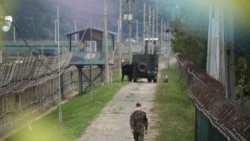 A South Korean soldier walks along a military fence near the demilitarized zone separating the two Koreas in Paju, South Korea, September 28, 2021.