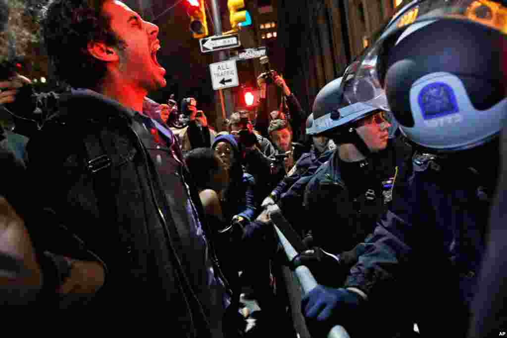 Nov. 15: A protester yells at police after being ordered to leave Zuccotti Park, their longtime encampment in New York. (AP Photo/Mary Altaffer)