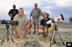 Photographer Brent Stapelkamp is seen with colleagues at the Hwange National Park in this 2014 photo. Stapelkamp, a lion researcher and part of a team that had tracked and studied Cecil the lion for nine years, darted him and attached a collar last year.