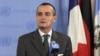 France's U.N. Ambassador Gerard Araud, the current Security Council president, answers reporters' questions at the United Nations after a closed meeting of the Security Council on Syria, August 16, 2012. 