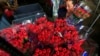 FILE - An employee organizes bouquets of flowers to be exported overseas, ahead of Valentine's Day, at Discovery Farm in Facatativa, Colombia, Feb. 8, 2018.